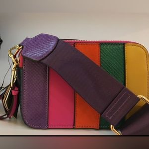 Multi-bright stripe crossbody with double zipper closure and adjustable strap.